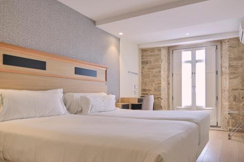 Habitación Doble Deluxe del hotel Praza Quintana. Foto 4