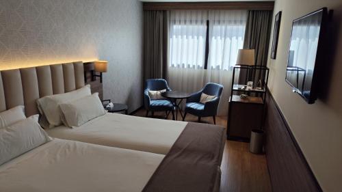 Habitación Doble Estándar con cama supletoria - 1 o 2 camas del hotel NH Ciudad Real
