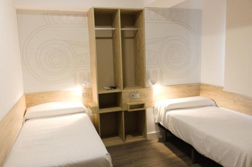 Habitación Doble adaptada para personas con discapacidad - 2 camas del hotel Deluxe Hostels And Suites Merida. Foto 1