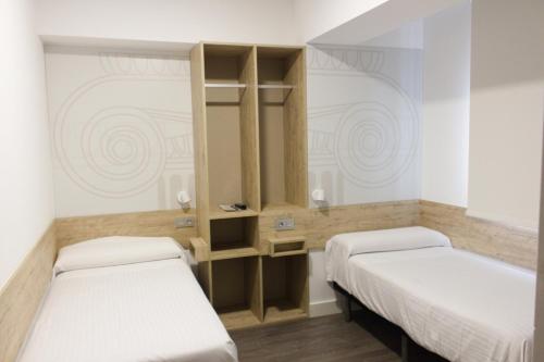 Habitación Doble adaptada para personas con discapacidad - 2 camas del hotel Deluxe Hostels And Suites Merida. Foto 2