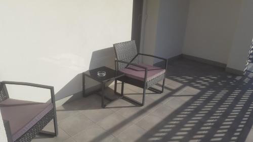Habitación Doble Deluxe con terraza del hotel Deluxe Hostels And Suites Merida. Foto 3