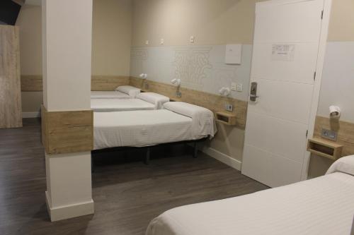 Habitación Cuádruple Deluxe del hotel Deluxe Hostels And Suites Merida. Foto 2