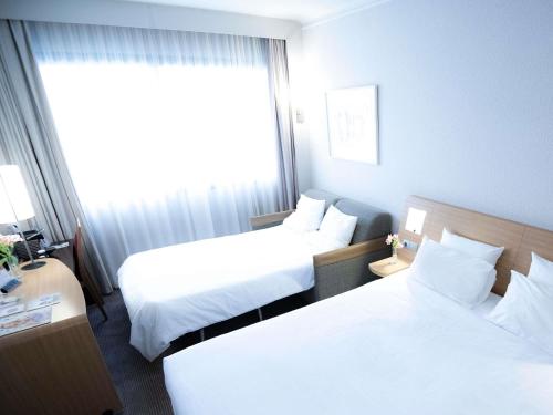 Executive Room with Acropolis View, 1 double bed and 1 double sofa bed del hotel Novotel Athenes. Foto 6