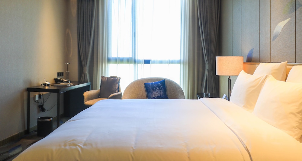 Habitación superior, 1 cama de matrimonio grande, vistas a la ciudad del hotel Pullman Nanchang Sunac