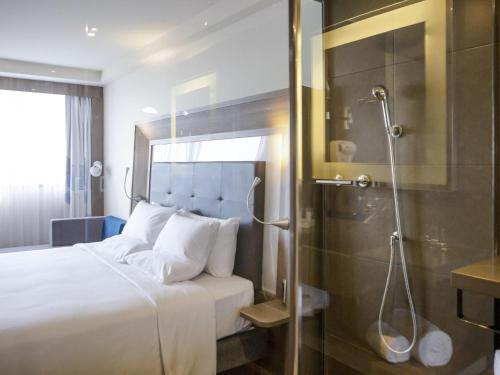 APARTAMENTO EJECUTIVO CON 1 CAMA QUEEN Y VISTA AL MAR del hotel Novotel Rj Porto Atlântico
