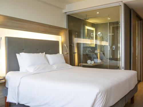 APARTAMENTO EJECUTIVO CON 1 CAMA QUEEN Y VISTA AL MAR del hotel Novotel Rj Porto Atlântico. Foto 4