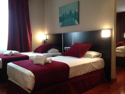 Habitación Cuádruple Clásica del hotel Clement Barajas