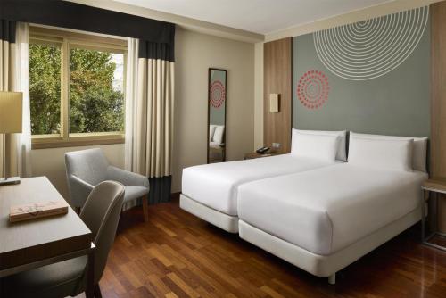 Habitación Familiar Contigua con cama supletoria del hotel iStay by NH Zaragoza Sport. Foto 4