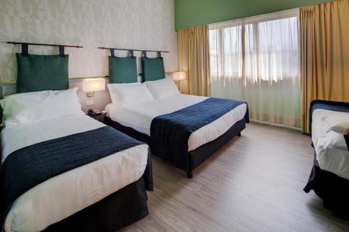 Habitación Clásica con 1 cama grande y 1 cama individual del hotel Best Western Plus CHC Florence. Foto 3