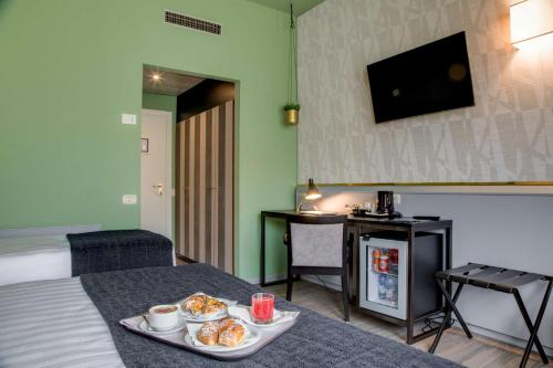 Habitación Clásica con 1 cama grande y 1 cama individual del hotel Best Western Plus CHC Florence. Foto 9