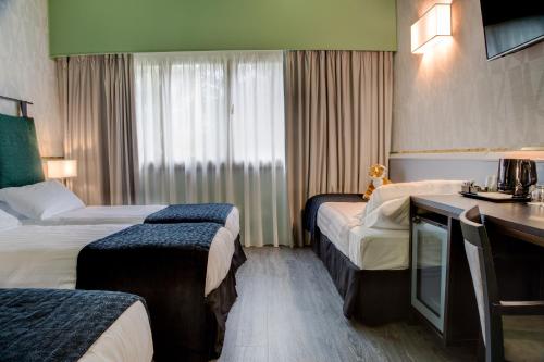 Habitación Familiar del hotel Best Western Plus CHC Florence. Foto 2