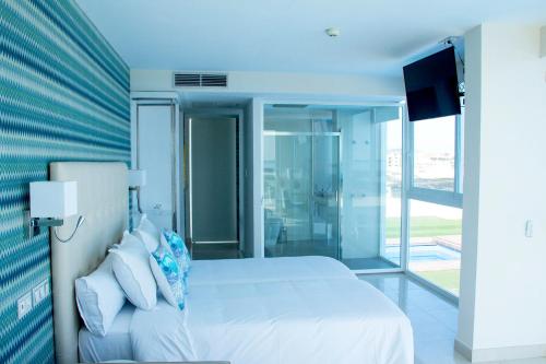 Suite Deluxe con vistas al mar del hotel Boutique Tao Caleta Mar. Foto 8