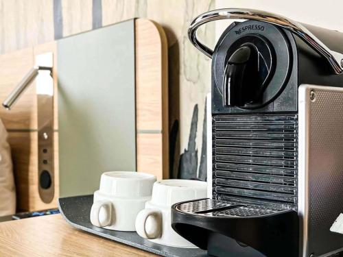 Habitación Doble Executive con sofá del hotel Novotel Madrid City Las Ventas. Foto 14