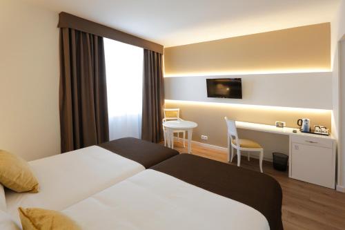 Habitación Doble - 2 camas del hotel Sercotel Alfonso Xiii. Foto 1