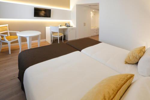 Habitación Doble - 2 camas del hotel Sercotel Alfonso Xiii. Foto 2
