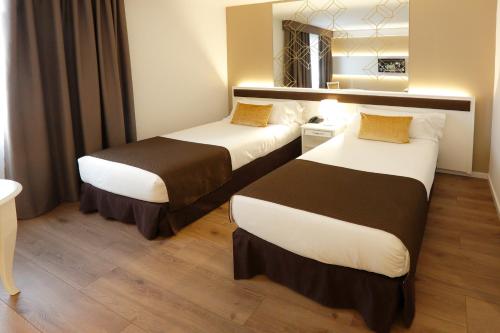 Habitación Doble - 2 camas del hotel Sercotel Alfonso Xiii. Foto 5