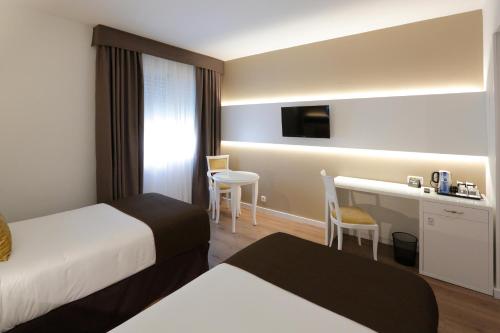 Habitación Doble - 2 camas del hotel Sercotel Alfonso Xiii. Foto 6