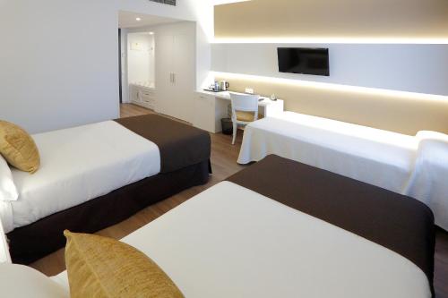 Habitación Triple del hotel Sercotel Alfonso Xiii. Foto 1