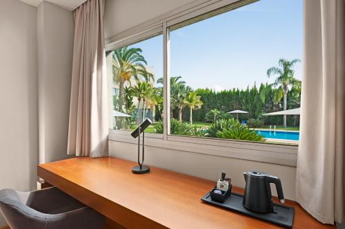 Habitación Doble - No fumadores del hotel Ramada By Wyndham Valencia Almussafes. Foto 4