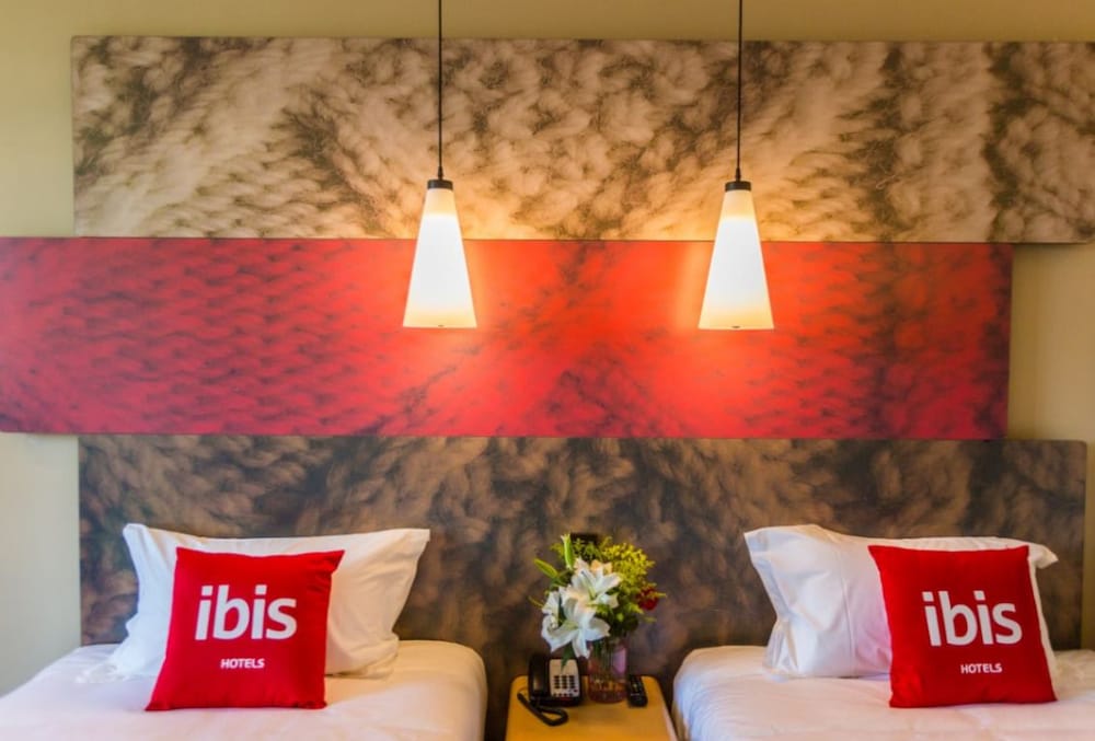 Habitación con 2 camas individuales del hotel Ibis Wenzhou University. Foto 1