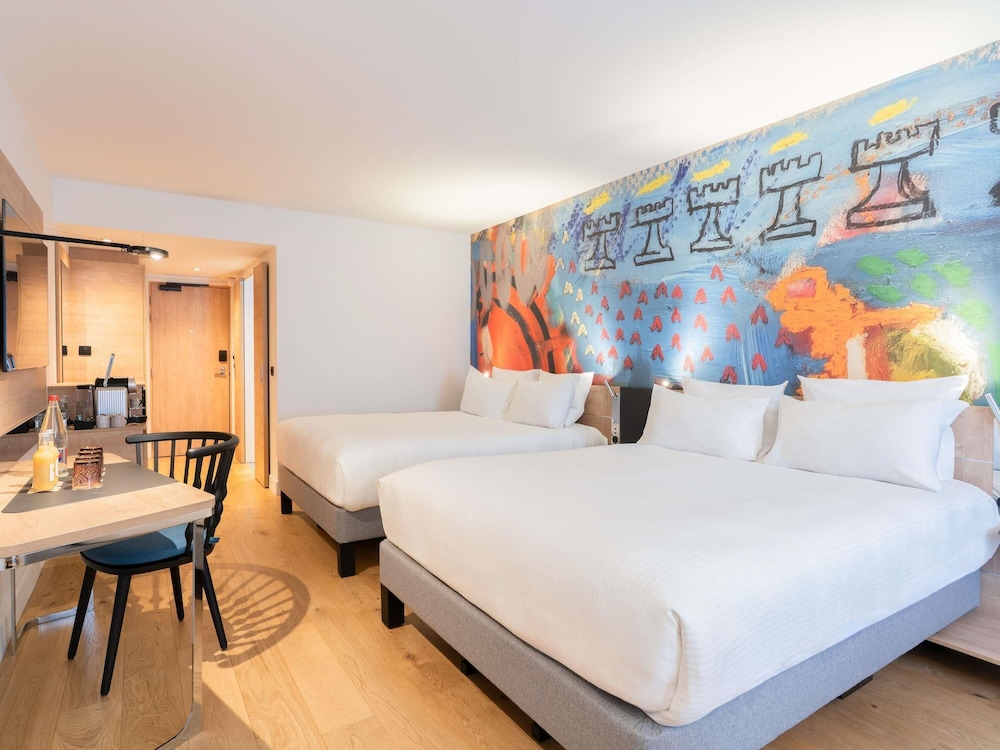 Habitación ejecutiva, 2 camas de matrimonio del hotel Novotel Les Halles. Foto 1