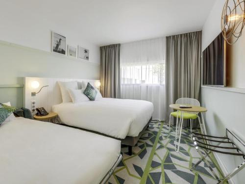 Habitación Estándar - 1 cama doble y 1 individual del hotel Mercure Orly Airport. Foto 6