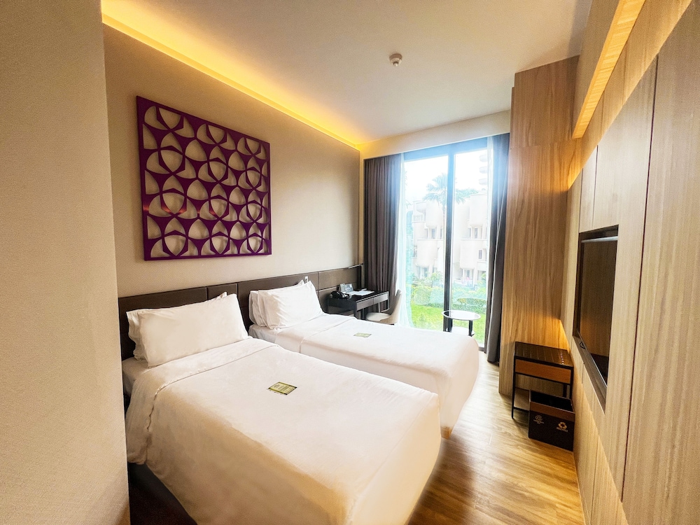 Habitación Deluxe con 2 camas individuales del hotel Mercure Singapore On Stevens. Foto 2