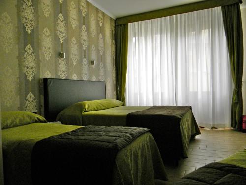 Habitación Triple del hotel Rome Kings Suite. Foto 2
