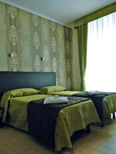 Habitación cuádruple del hotel Rome Kings Suite. Foto 7