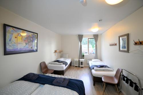 Habitación Cuádruple con baño compartido del hotel Klausturhof Guesthouse. Foto 2