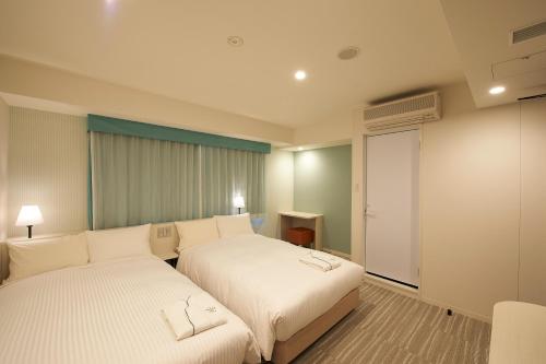 Habitación Doble - No fumadores - 2 camas del hotel Sotetsu Fresa Inn Ginza Sanchome. Foto 3