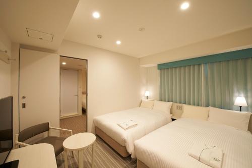 Habitaciones comunicadas - No fumadores del hotel Sotetsu Fresa Inn Ginza Sanchome. Foto 6