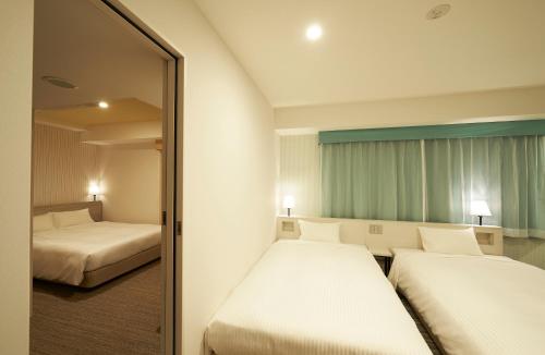 Habitaciones comunicadas - No fumadores del hotel Sotetsu Fresa Inn Ginza Sanchome. Foto 10