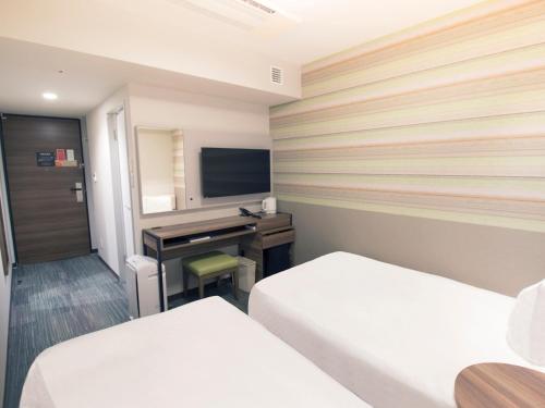 Habitación Económica con 2 camas individuales - No fumadores del hotel Hearton Shinsaibashi Nagahoridori. Foto 4