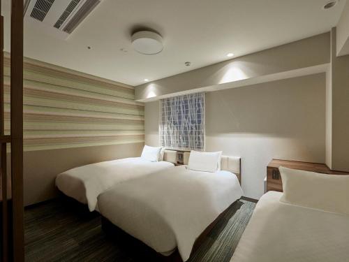Habitación Triple - No fumadores del hotel Hearton Shinsaibashi Nagahoridori. Foto 1