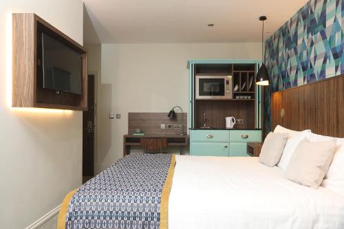 Estudio Cama Litera 1 Cama king kitchenette del hotel Cairn. Foto 1
