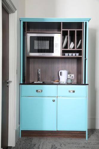 Estudio Cama Litera 1 Cama king kitchenette del hotel Cairn. Foto 6