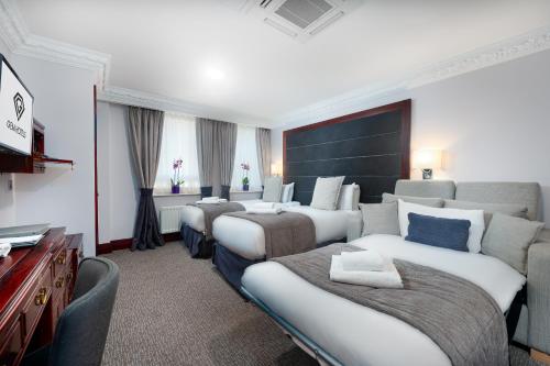 Habitación Triple Confort del hotel Fitzrovia. Foto 5
