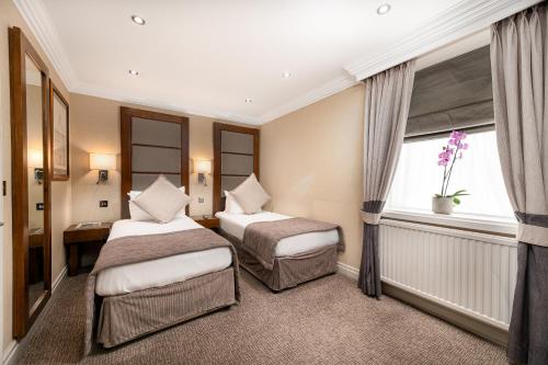 Habitación Executive - 2 camas del hotel Gem Langham Court. Foto 4