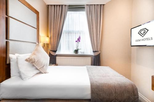 Habitación Individual del hotel Gem Langham Court. Foto 4