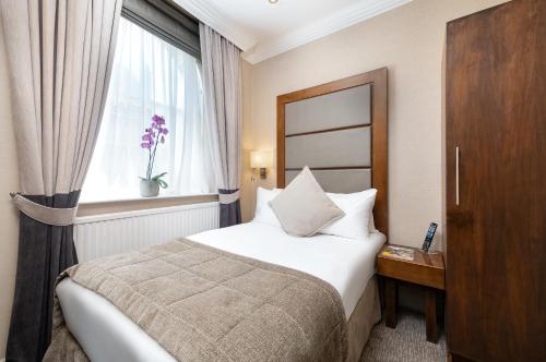 Habitación Individual Executive del hotel Gem Langham Court. Foto 2