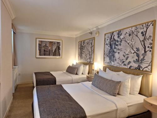 Habitación con 2 camas grandes del hotel Warwick Allerton - Chicago. Foto 6