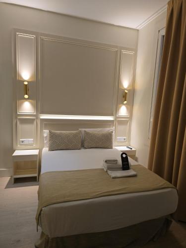 Habitación Doble Deluxe con cama supletoria del hotel Le Petit Palü-fuencarral. Foto 1