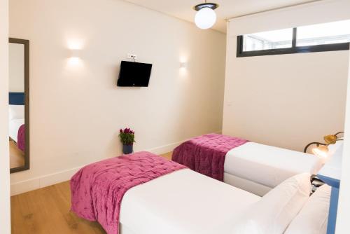 Habitación Familiar del hotel Cicerone De Sevilla. Foto 2