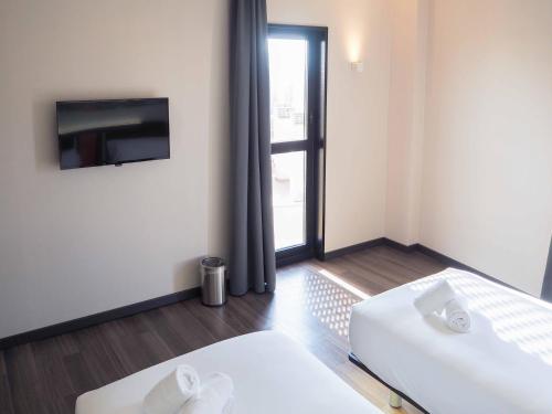 Habitación Doble adaptada para personas con discapacidad - 2 camas del hotel Easyhotel Barcelona Fira. Foto 4