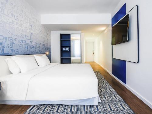 Habitación Doble Executive con vistas parciales al mar del hotel Novotel Rio De Janeiro Leme. Foto 3