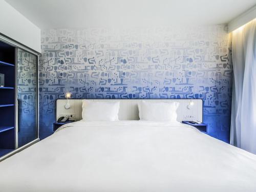 Habitación Doble Executive con vistas parciales al mar del hotel Novotel Rio De Janeiro Leme. Foto 4