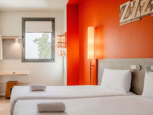 Habitación Doble Estándar - 2 camas del hotel Ibis Budget Madrid Centro Lavapies. Foto 5