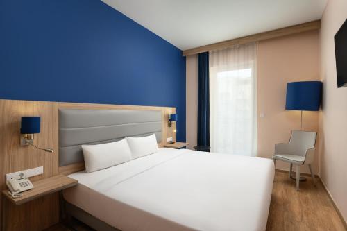 Habitación Estándar - 1 o 2 camas del hotel Akeah Verdi Budapest. Foto 1