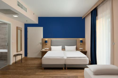 Habitación Triple Deluxe del hotel Akeah Verdi Budapest